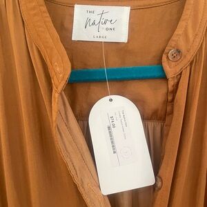 This local boutique sold dress is NWT size large. Perfect for any event.